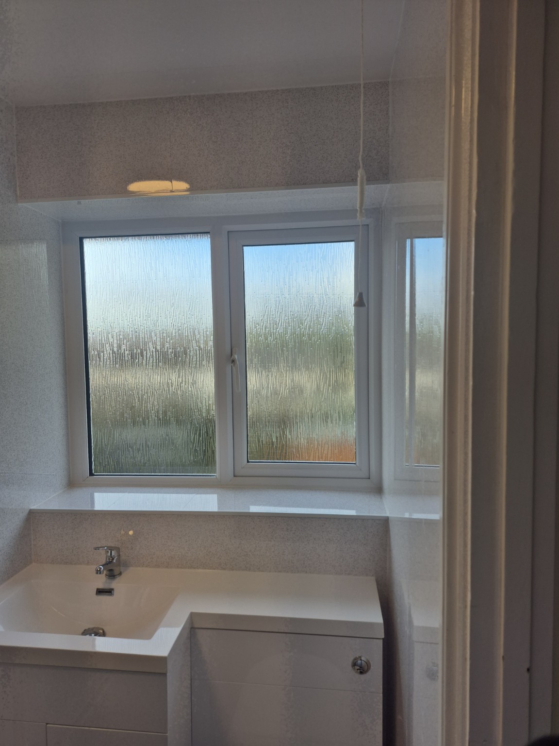 Bathroom Refurbishment - Finished vanity beneath frosted windows