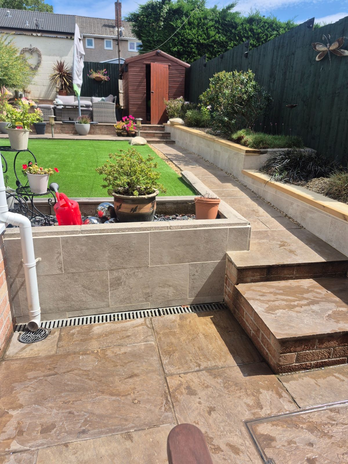 Exterior wall tiling & timber capping project by SRG - Limited
